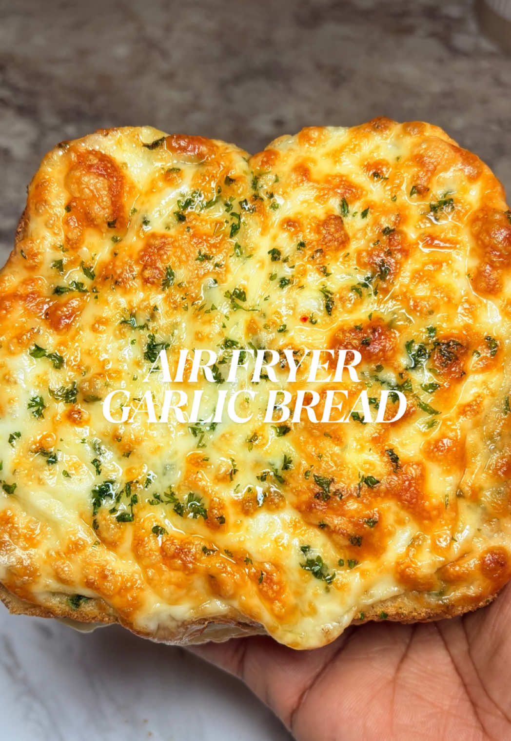 This Air Fryer Garlic Bread is a MUST try for the Super Bowl😋 Ingredients: -Texas toast -Unsalted butter -Roasted Garlic -Parsley  -Mozzarella Cheese  Airfry at 350 degrees F for 5-6 minutes  #garlicbread #cheesybread #superbowlsnacks #easyrecipe #snackideas 